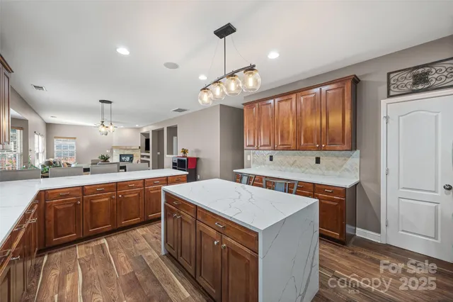 a kitchen with a stove a sink and a refrigerator