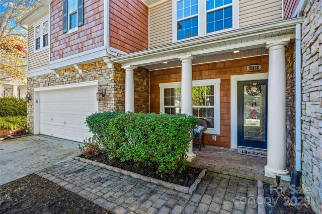 a front view of a building with garden