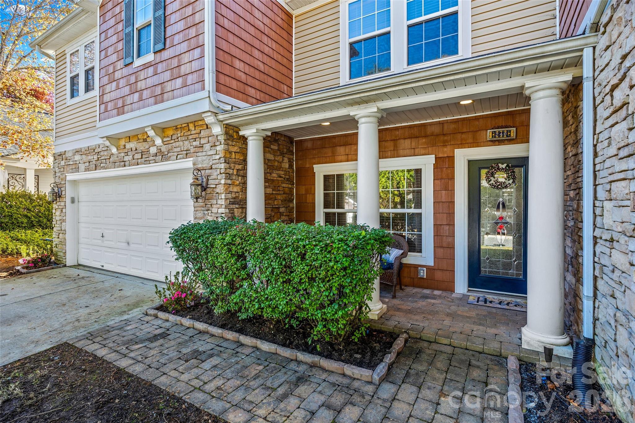 240 Loch Stone Street Fort Mill, SC 29715 - Photo 2 of 45 a front view of a building with garden