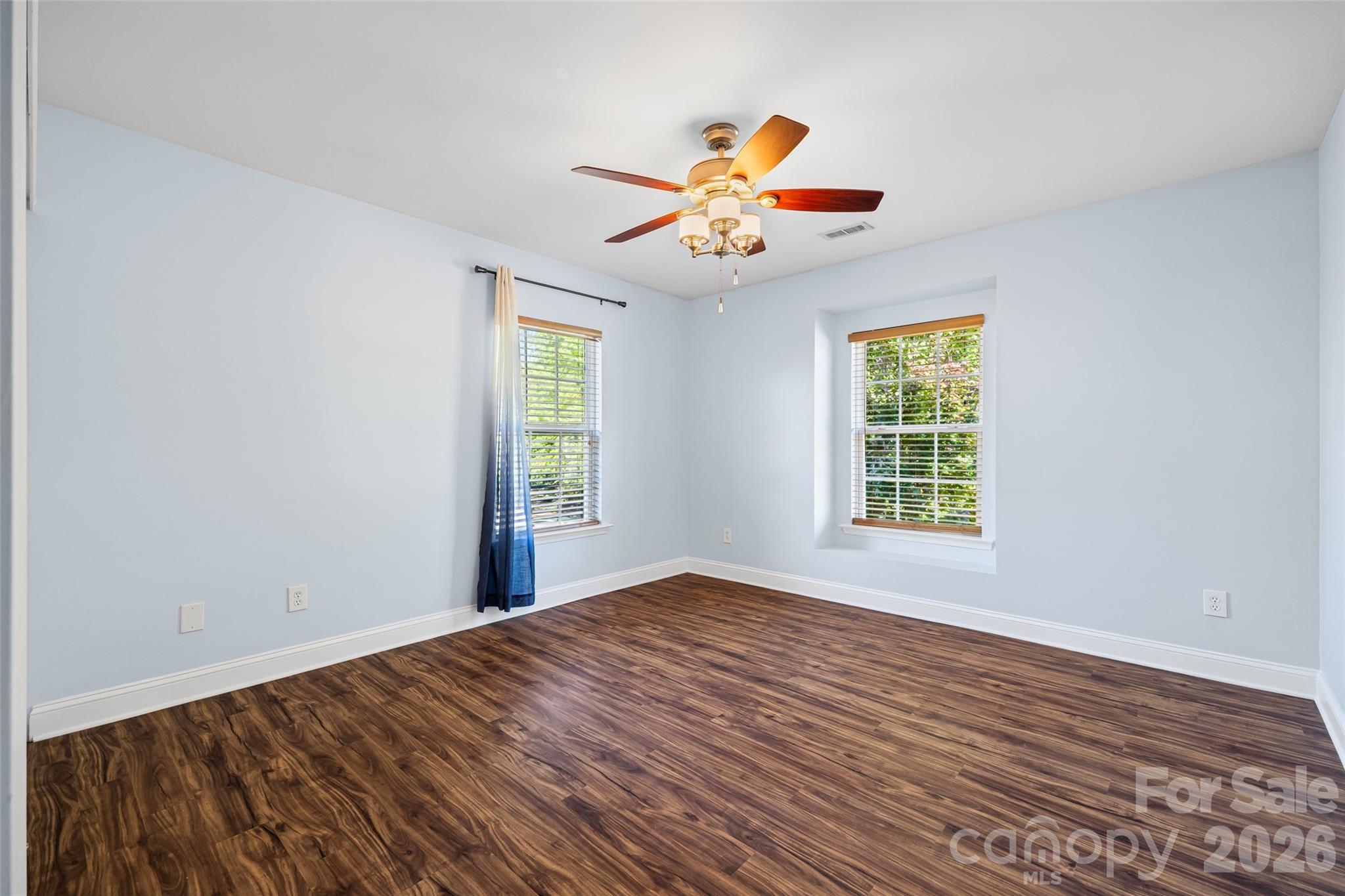 240 Loch Stone Street Fort Mill, SC 29715 - Photo 29 of 45 a view of an empty room with window and wooden floor