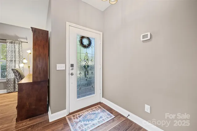 a view of an empty room and glass door