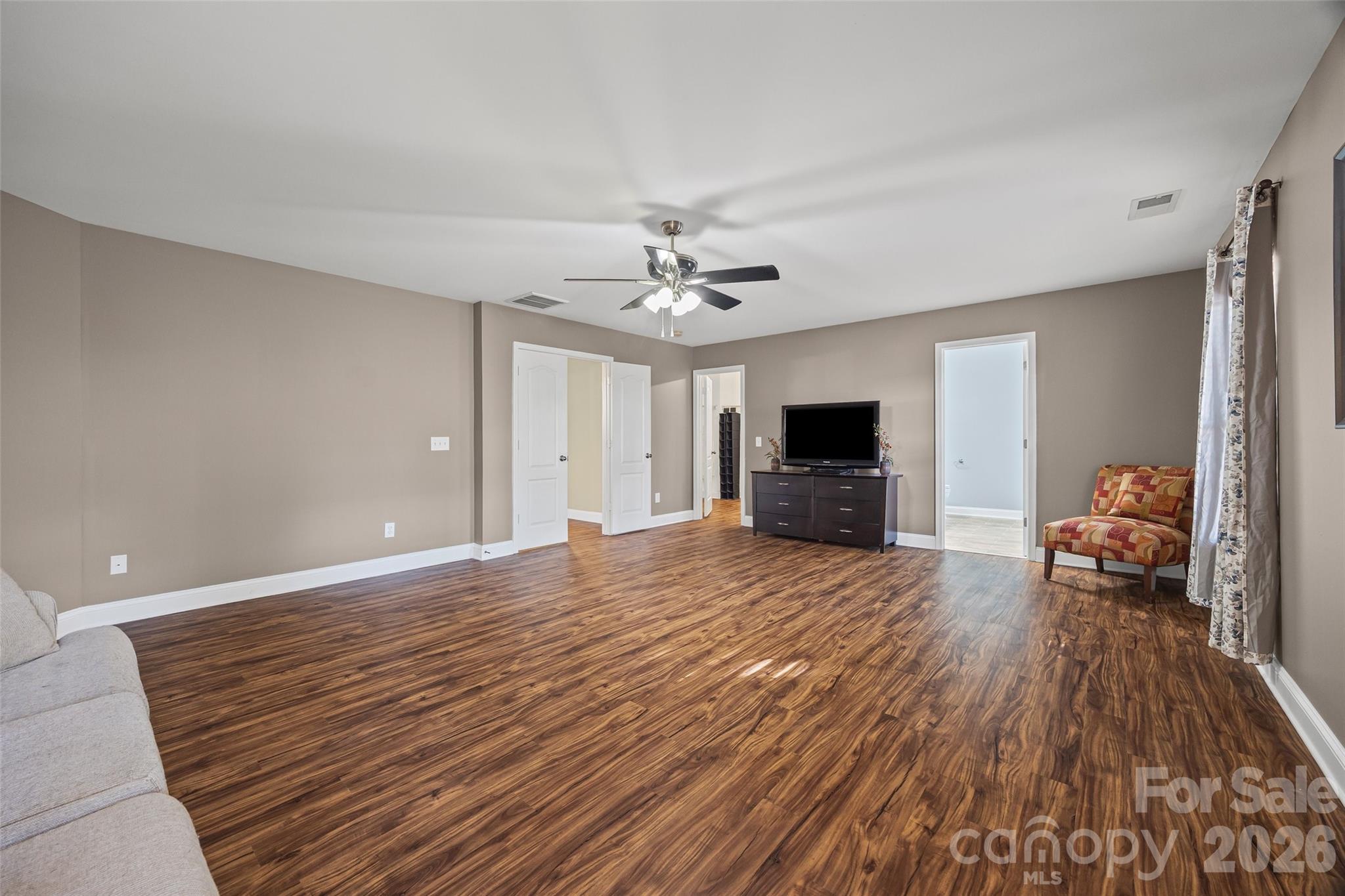 240 Loch Stone Street Fort Mill, SC 29715 - Photo 38 of 45 a living room with furniture and a flat screen tv