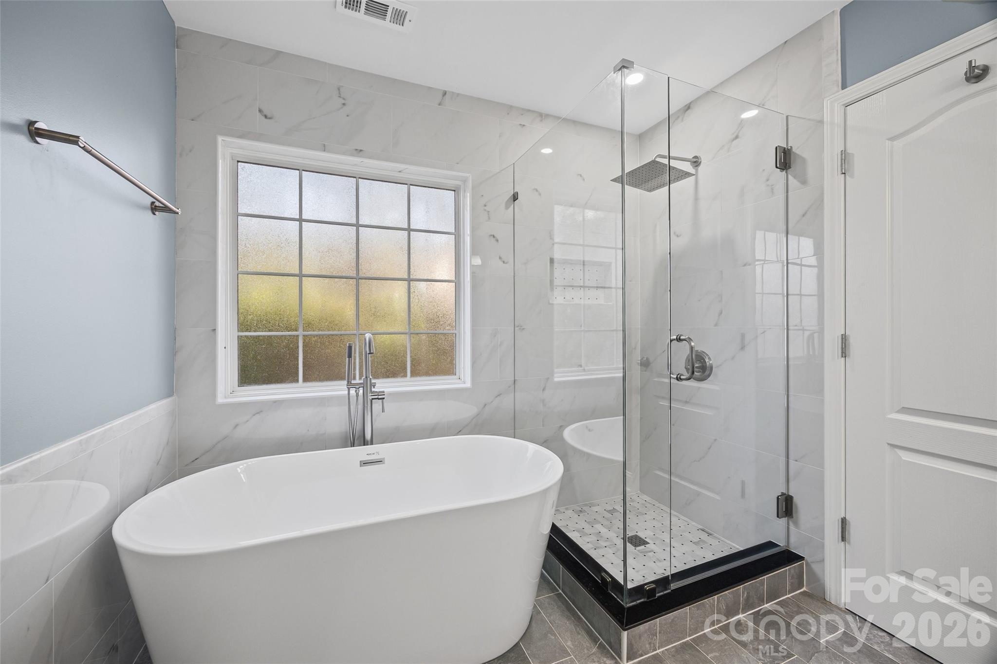 240 Loch Stone Street Fort Mill, SC 29715 - Photo 40 of 45 a white bath tub sitting next to a shower