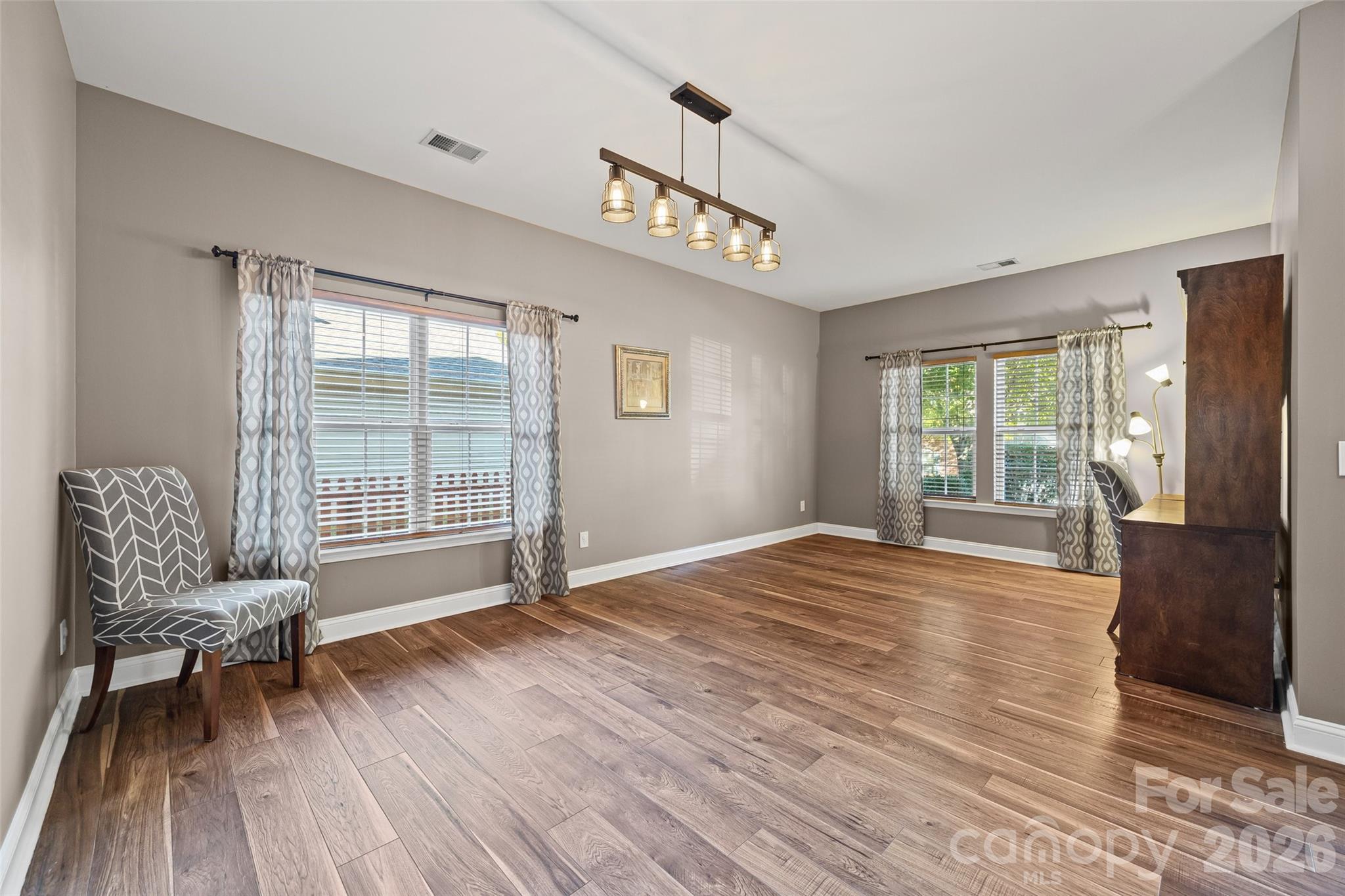 240 Loch Stone Street Fort Mill, SC 29715 - Photo 4 of 45 a view of a livingroom with furniture and wooden floor