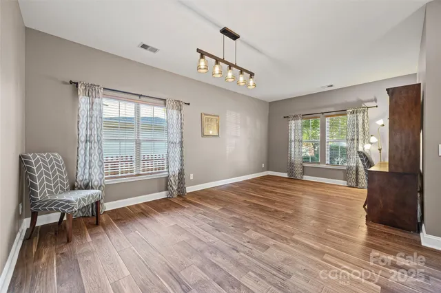 a view of a livingroom with furniture and wooden floor