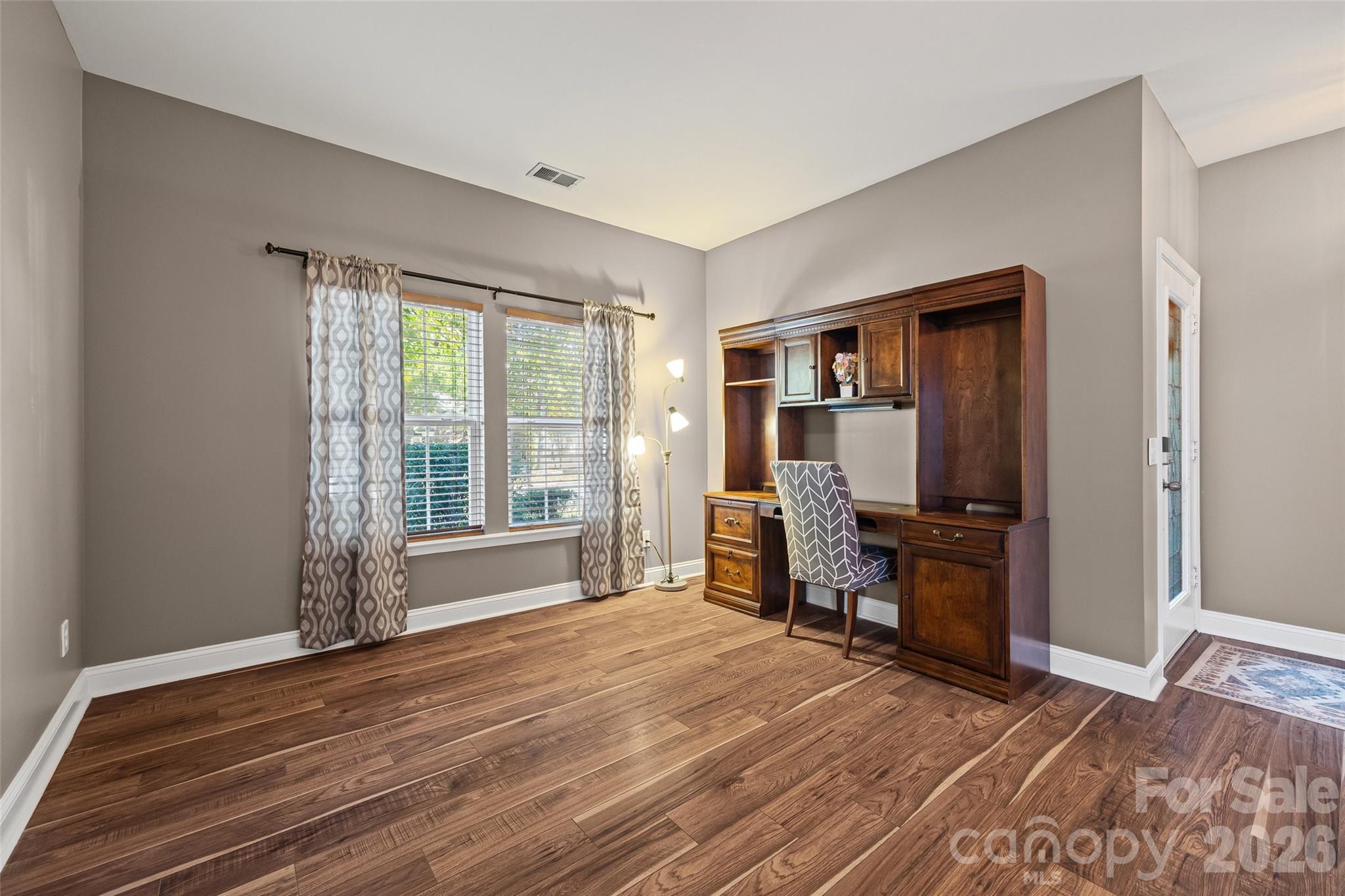 240 Loch Stone Street Fort Mill, SC 29715 - Photo 5 of 45 a view of room with window and wooden floor