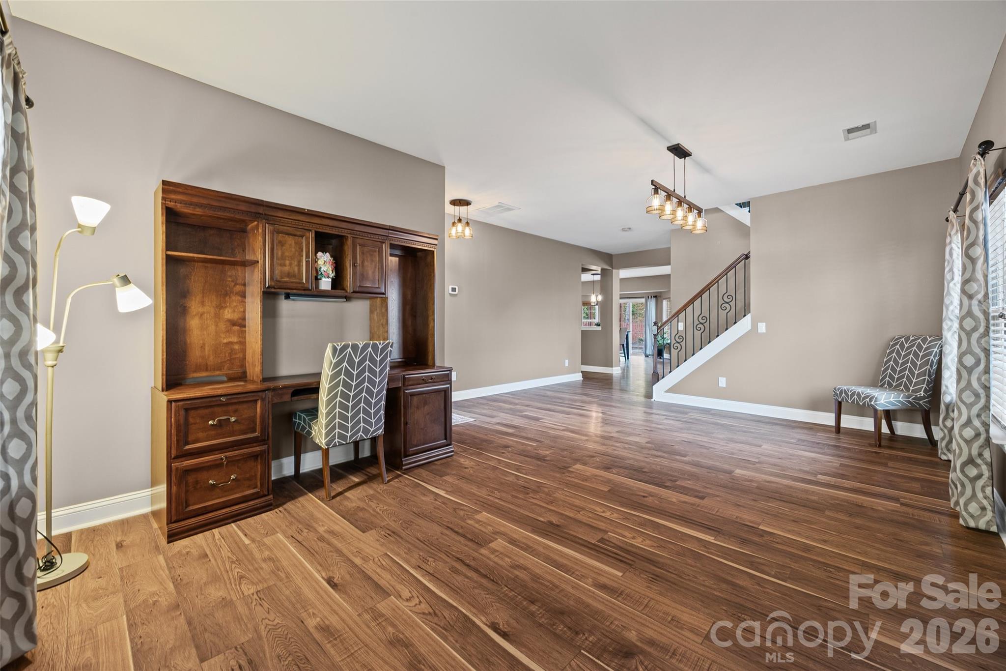240 Loch Stone Street Fort Mill, SC 29715 - Photo 6 of 45 a living room with furniture and a wooden floor