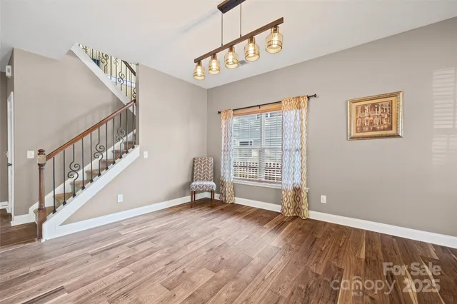 a view of an entryway with wooden floor
