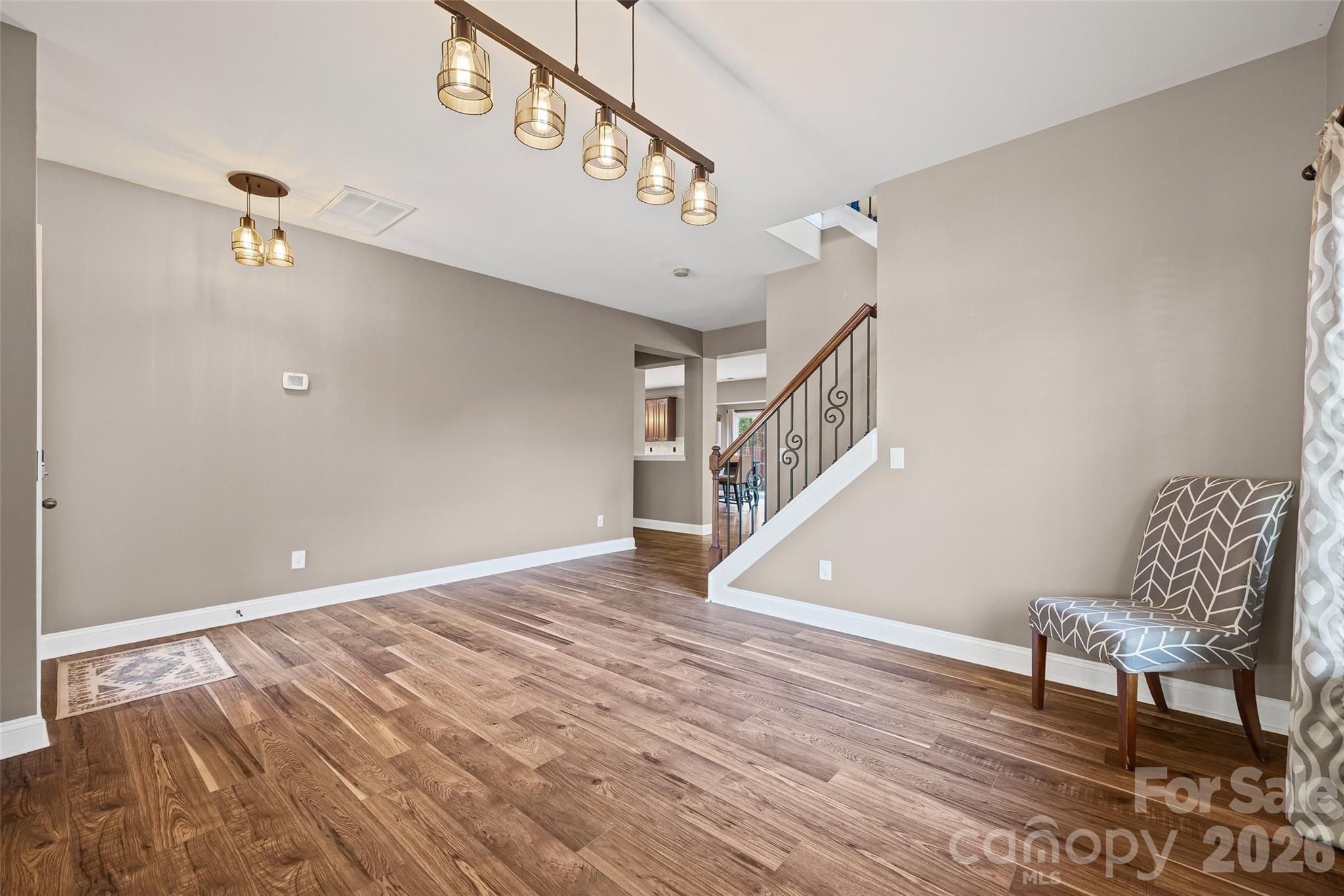 240 Loch Stone Street Fort Mill, SC 29715 - Photo 8 of 45 a view of an entryway with wooden floor