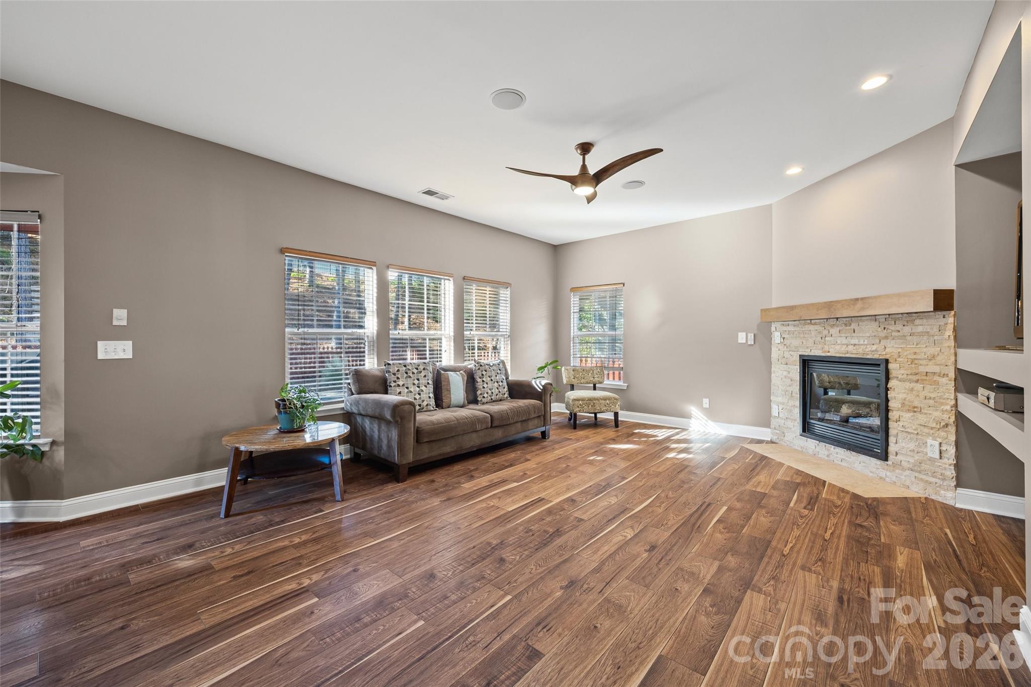 240 Loch Stone Street Fort Mill, SC 29715 - Photo 10 of 45 a living room with furniture and a fireplace