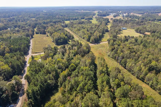 an aerial view of residential house and outdoor space