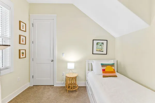 a view of a bedroom with a bed and toys