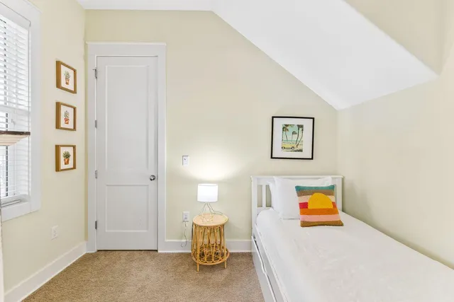 a view of a bedroom with a bed and toys