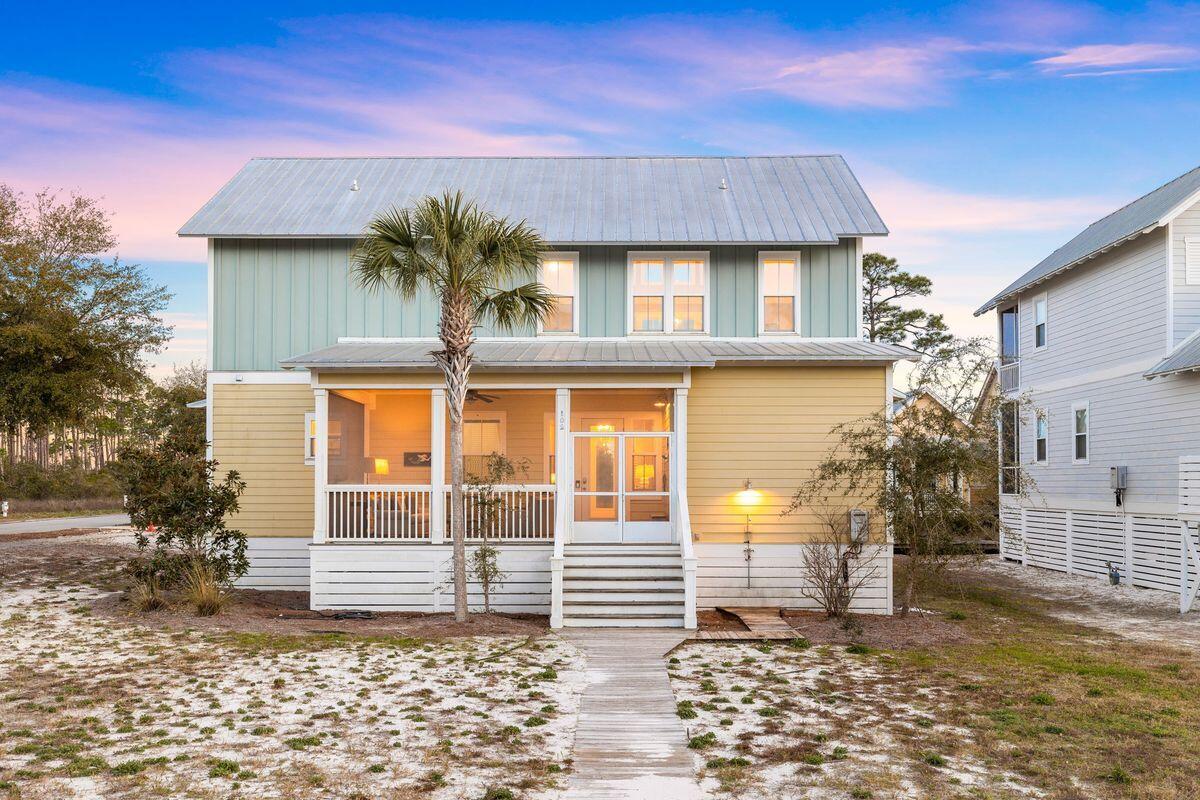 102 Goldfish Court Port St. Joe, FL 32456 - Photo 2 of 31 a front view of a house with garden