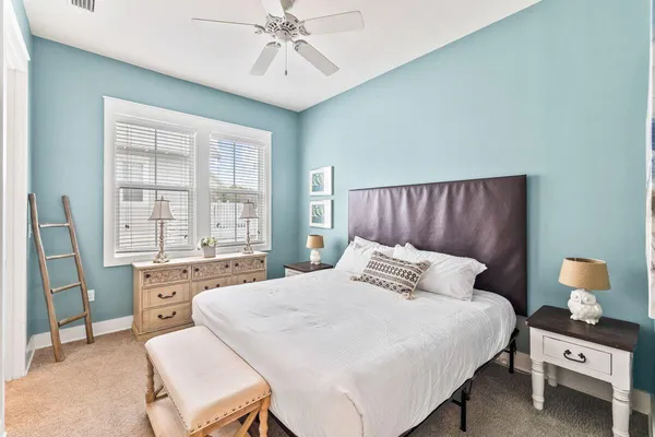 a bedroom with a bed and window