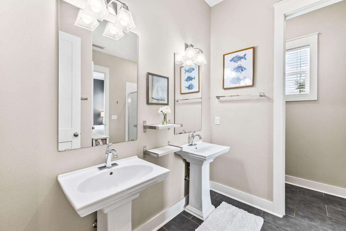 102 Goldfish Court Port St. Joe, FL 32456 - Photo 23 of 31 a bathroom with a sink and a mirror