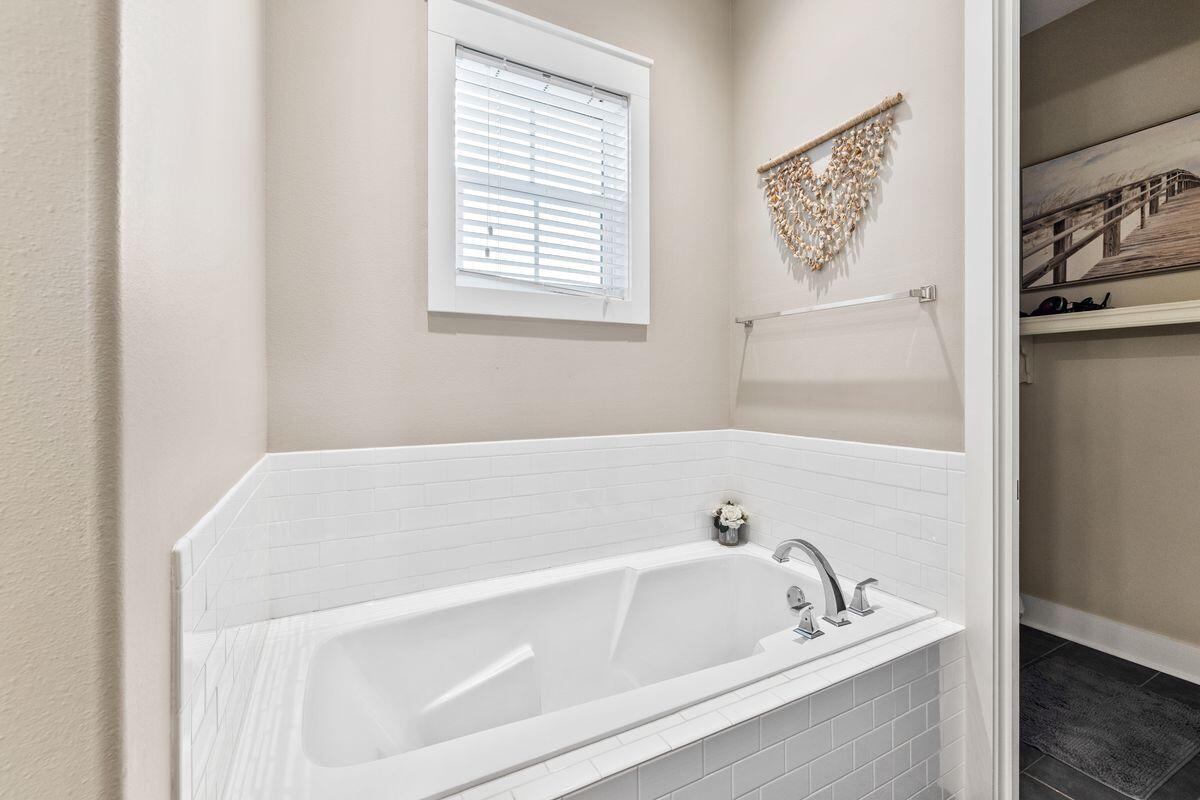 102 Goldfish Court Port St. Joe, FL 32456 - Photo 25 of 31 a white bath tub sitting next to a window
