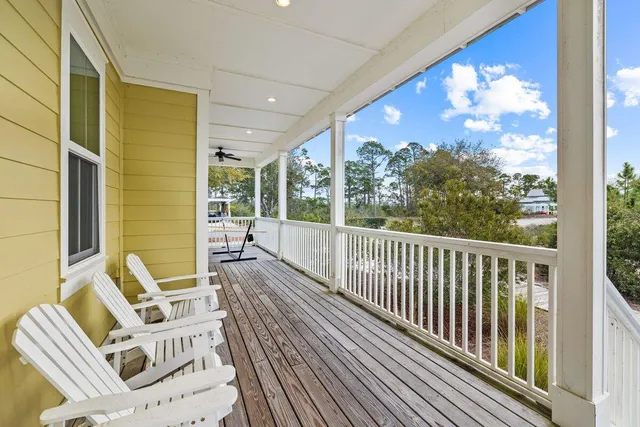 a view of a balcony with furniture