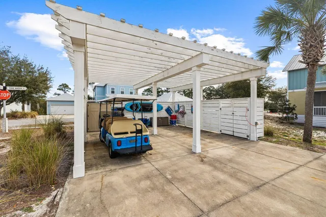 a view of a patio with table and chairs