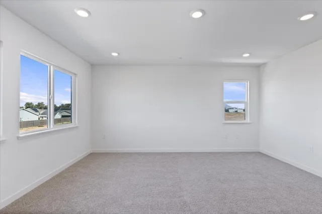a view of an empty room and a window