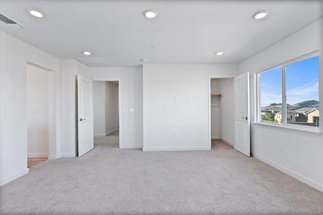a bathroom with a double vanity sink a mirror and a bathtub