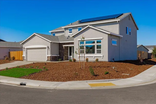 a front view of a house with yard