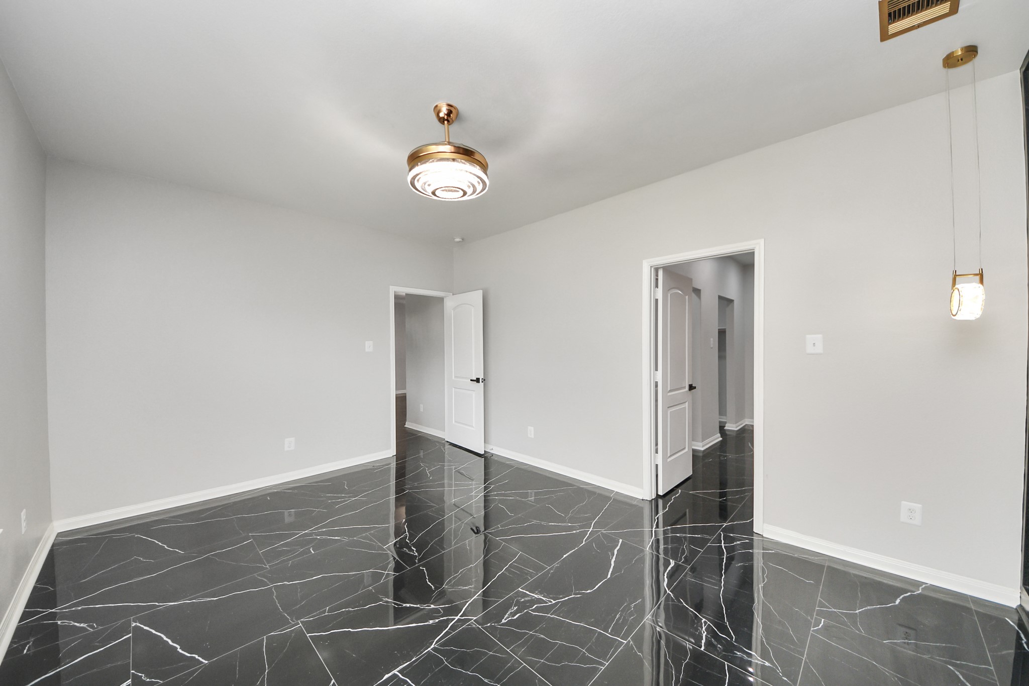 6931 Primrose Road Baytown, TX 77521 - Photo 20 of 50 Primary bedroom with direct access to the living room and private ensuite bathroom.