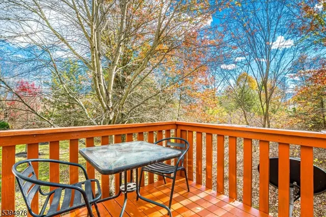 a view of a chairs and table in the balcony