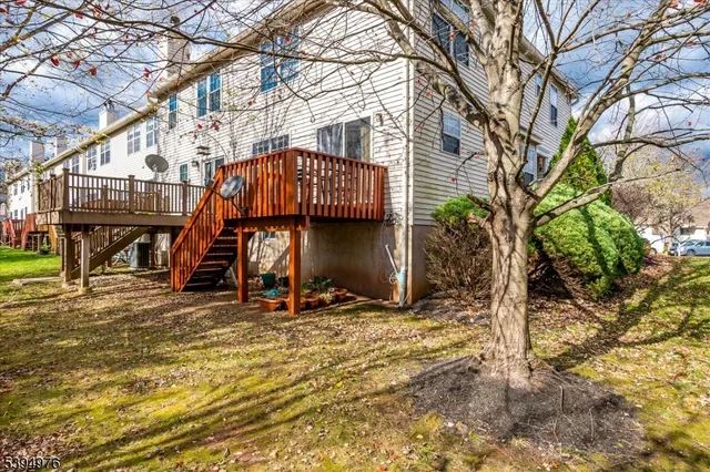 a view of a tiny house with a small yard