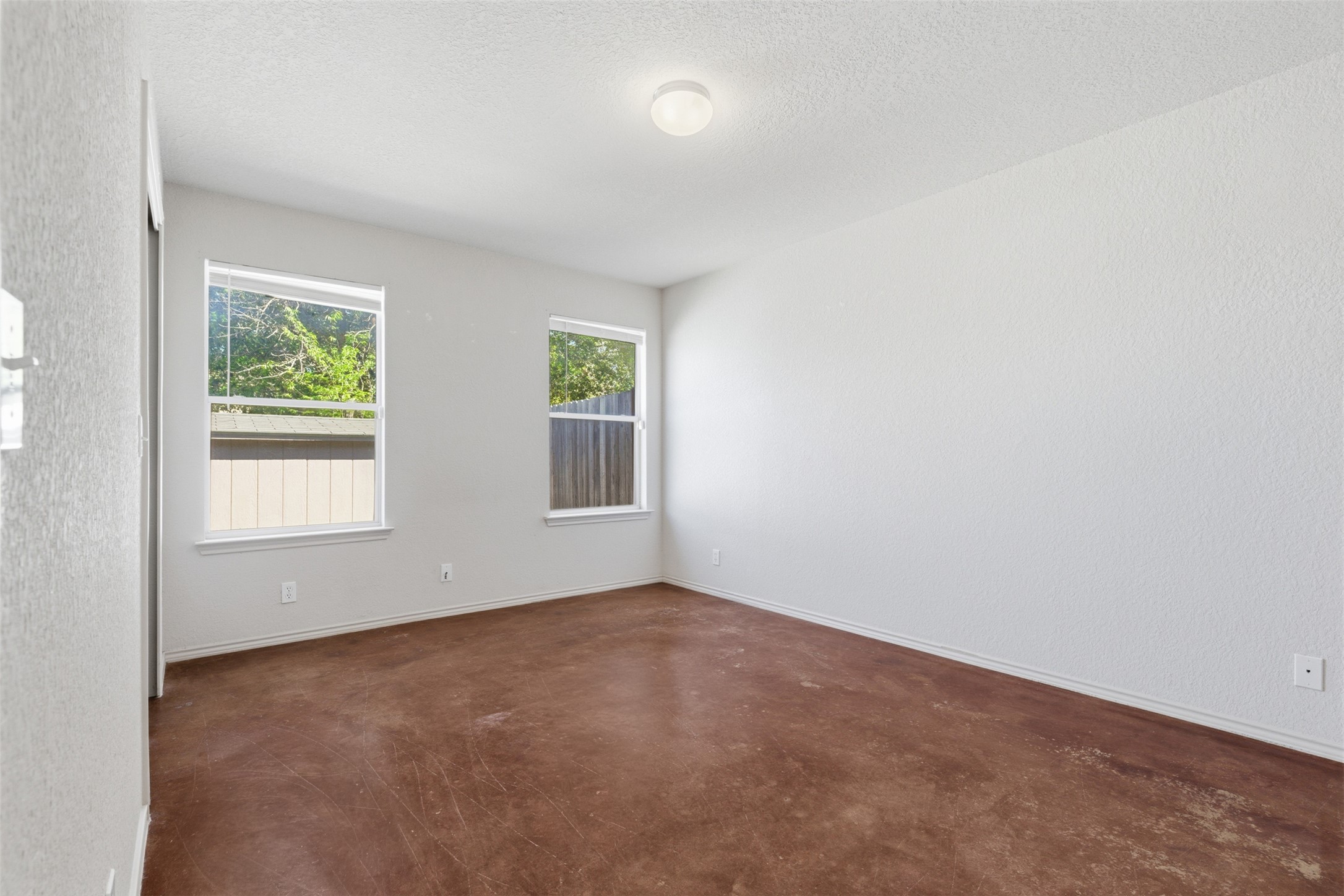 4529 Secure Lane, Unit 31 Austin, TX 78725 - Photo 16 of 38 an empty room with windows