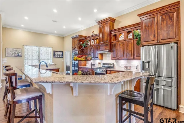 a bedroom with a bed couch and window