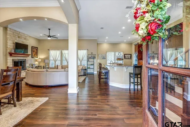 a view of a dining room with furniture wooden floor and chandelier