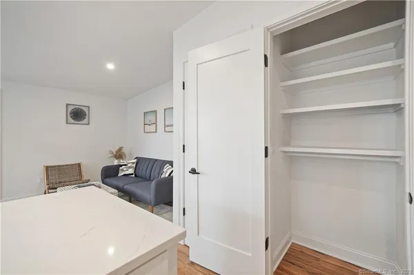 a bedroom with a bed and a view of bathroom