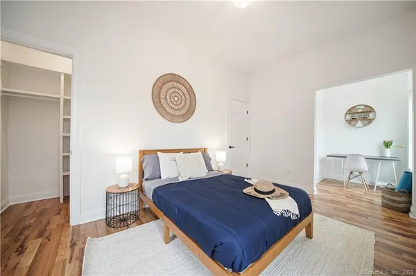 a bed room with a bed and a table