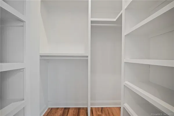a view of an empty walk in closet