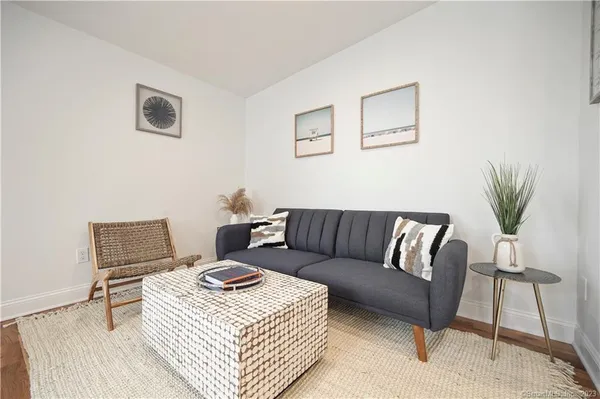 a living room with furniture and a rug