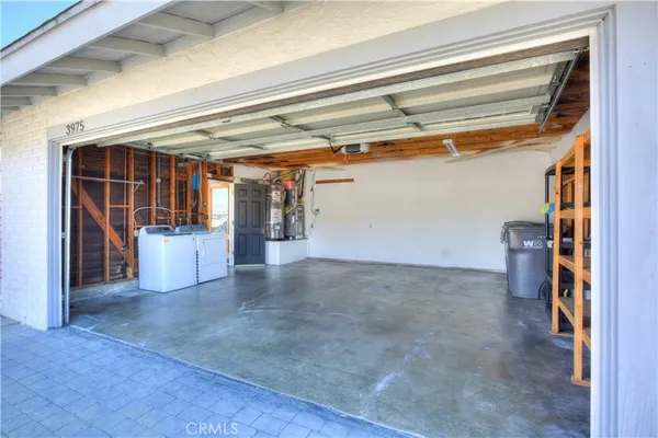a front view of a house with a garden and yard