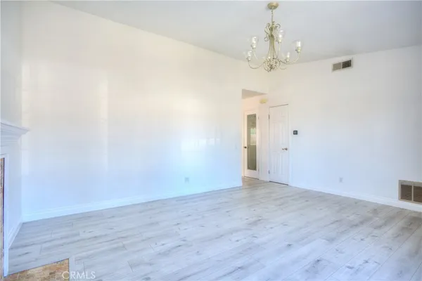 a kitchen with stainless steel appliances granite countertop a refrigerator a sink and a stove