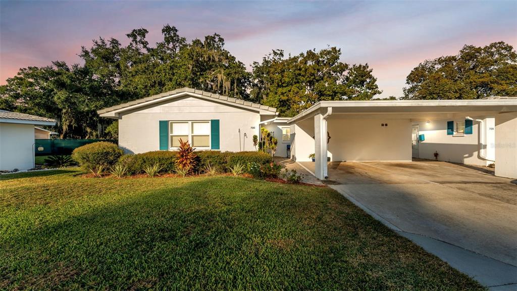 730 Barber Circle Lakeland, FL 33803 - Photo 1 of 1 a front view of a house with garden