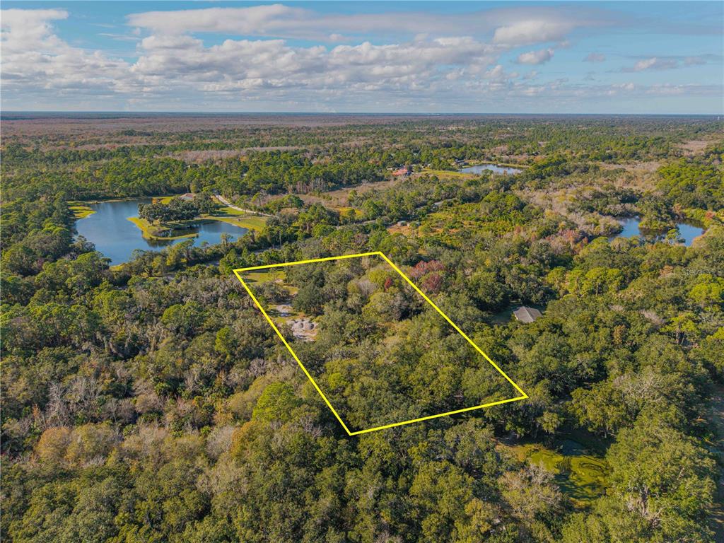 480 Clinton Cemetery Road Edgewater, FL 32141 - Photo 1 of 29 a view of a lake with a mountain