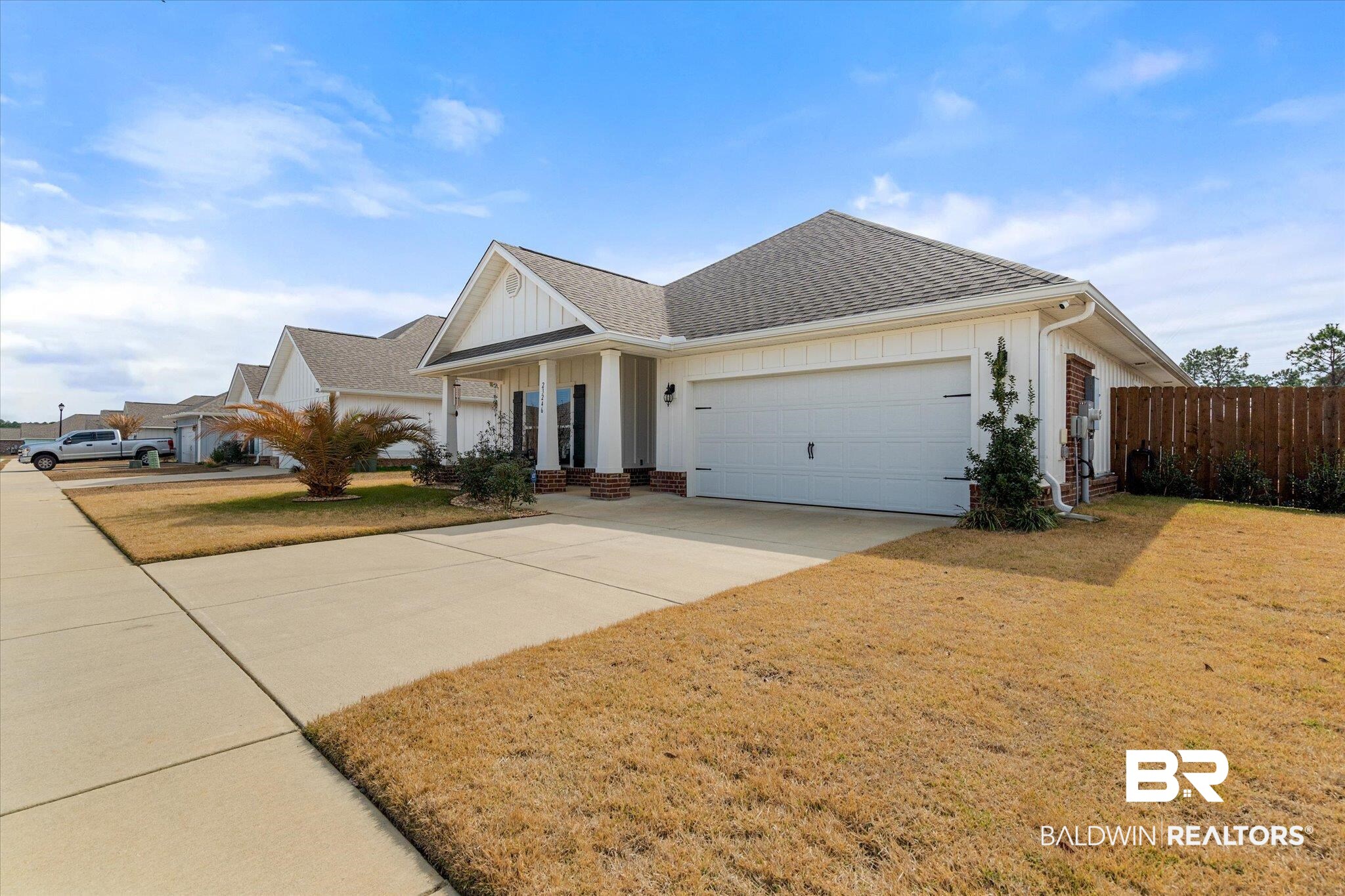 23246 Lieutenant Avenue Foley, AL 36535 - Photo 5 of 36 View of front facade with a garage and a front yard