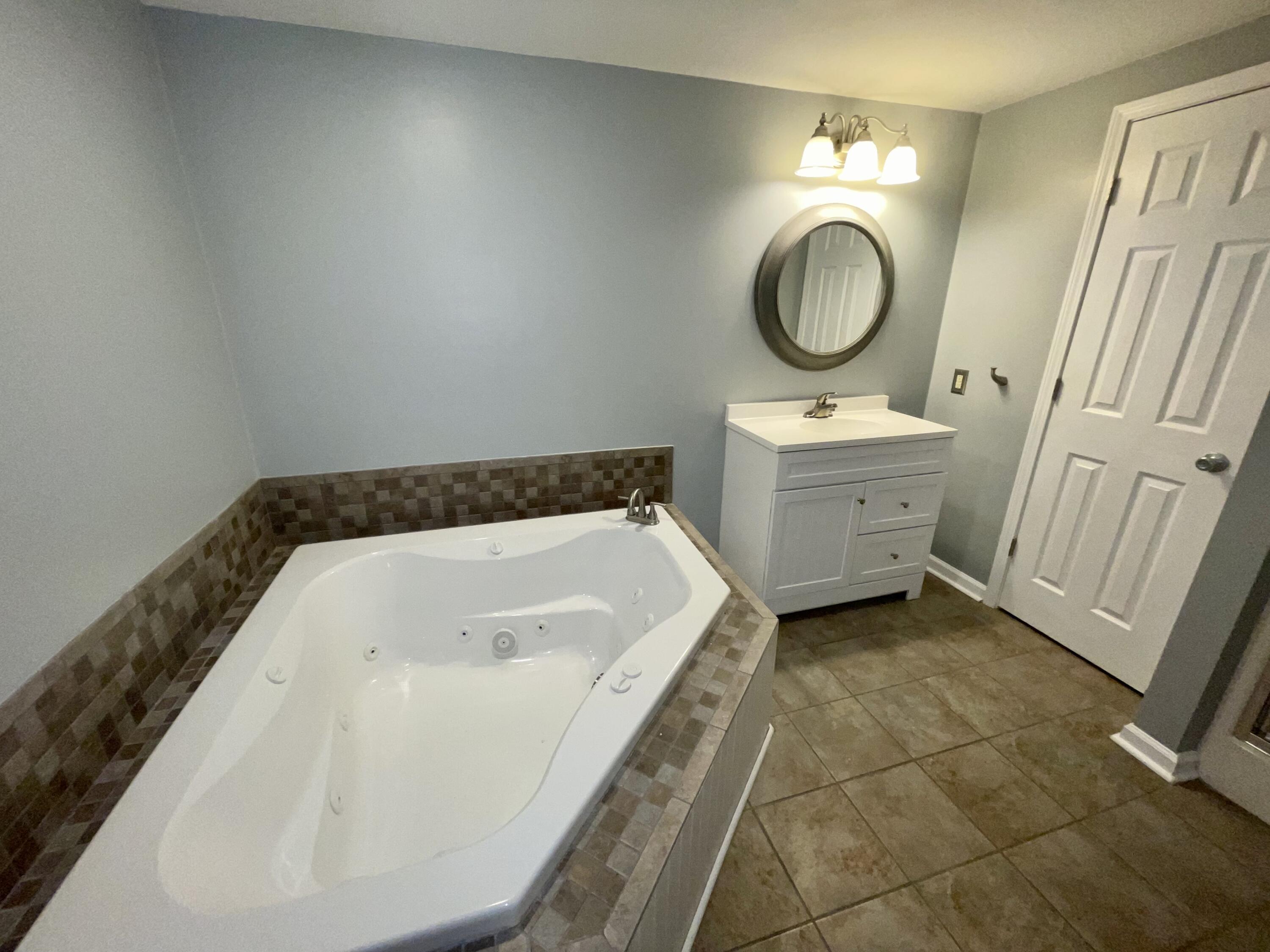 2143 Deep Woods Road Hardy, VA 24101 - Photo 15 of 27 a bathroom with a bathtub and a sink