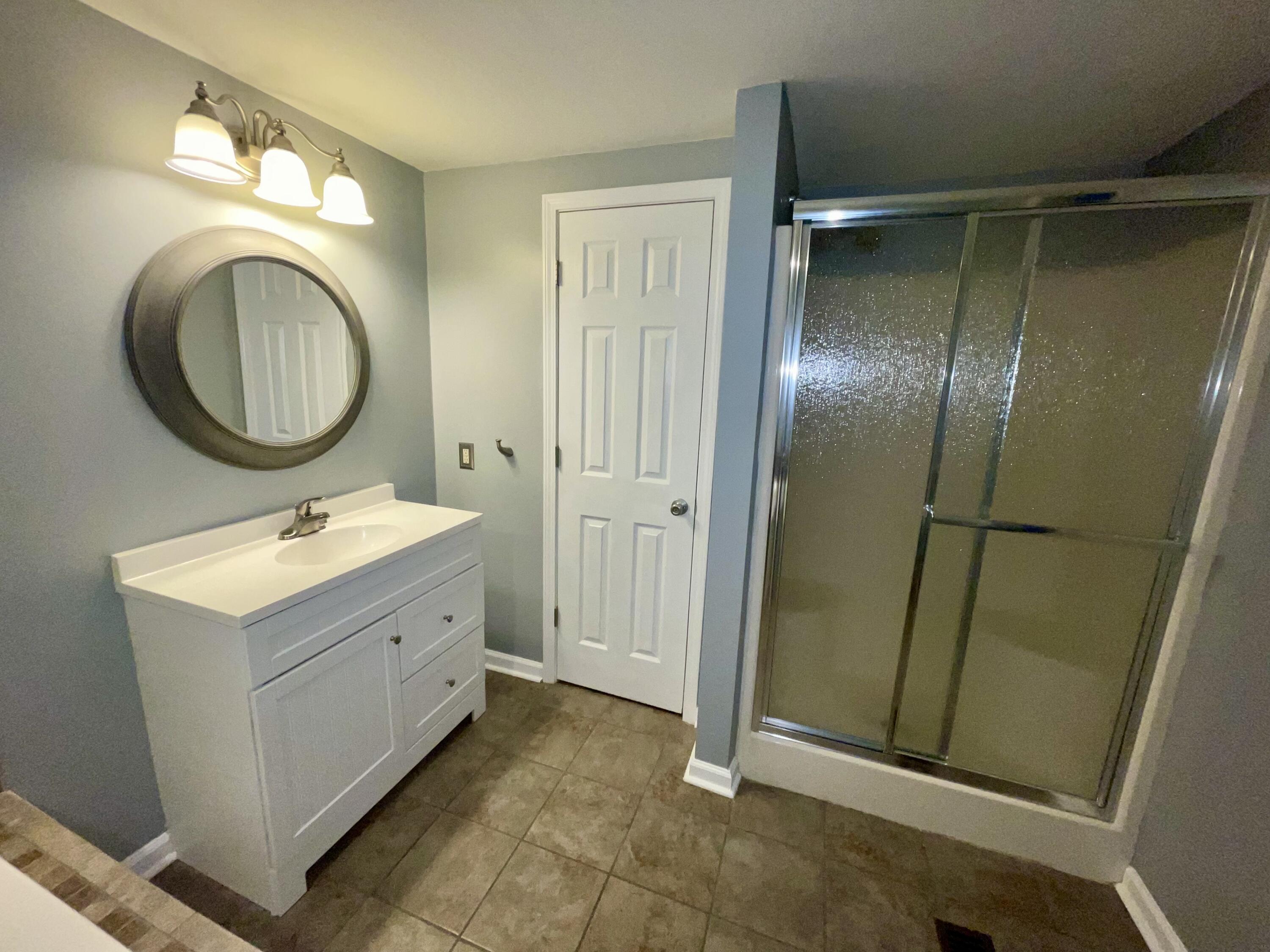 2143 Deep Woods Road Hardy, VA 24101 - Photo 16 of 27 a bathroom with a double vanity sink and a mirror
