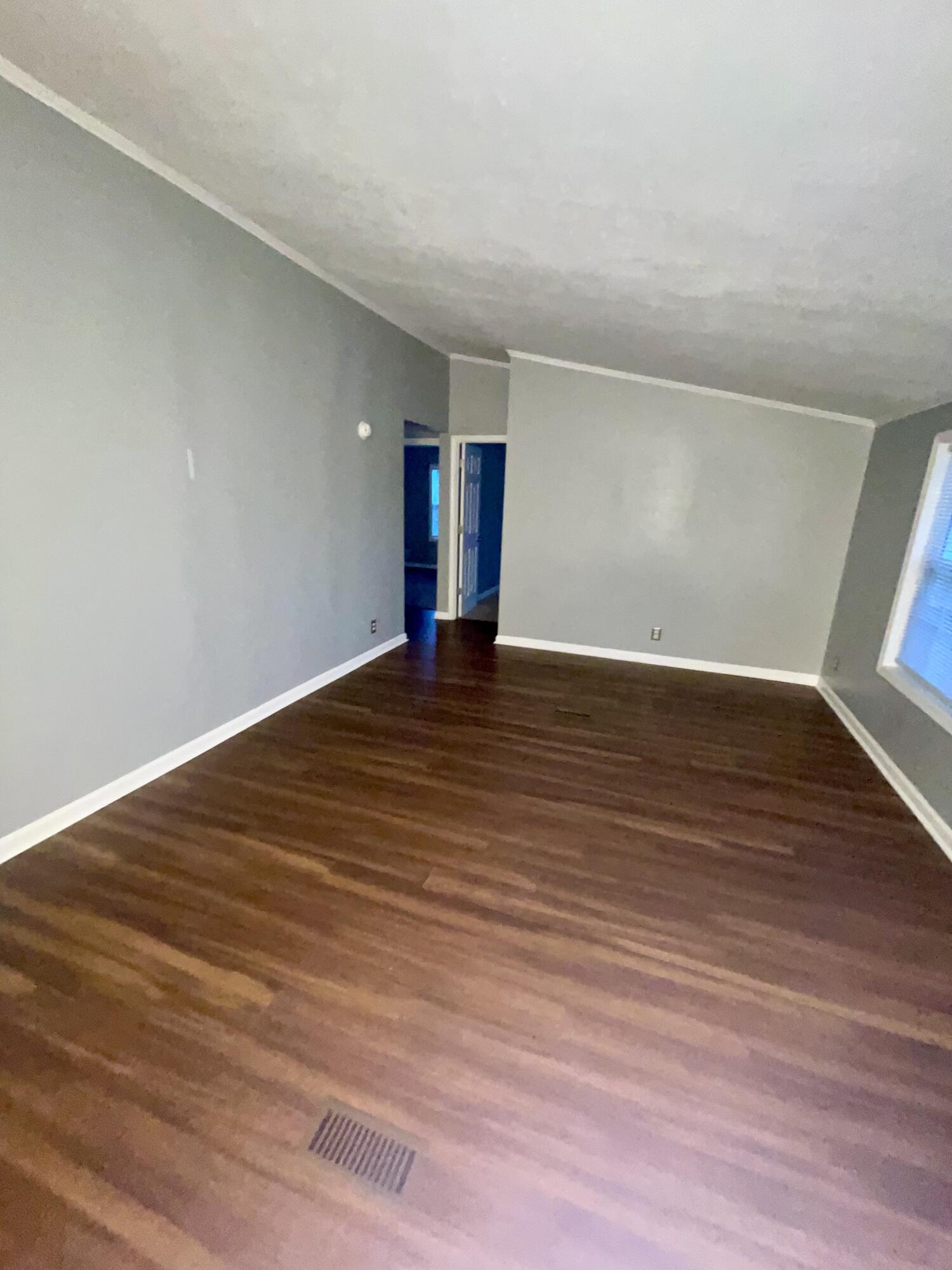 2143 Deep Woods Road Hardy, VA 24101 - Photo 4 of 27 a view of an empty room with wooden floor and a window