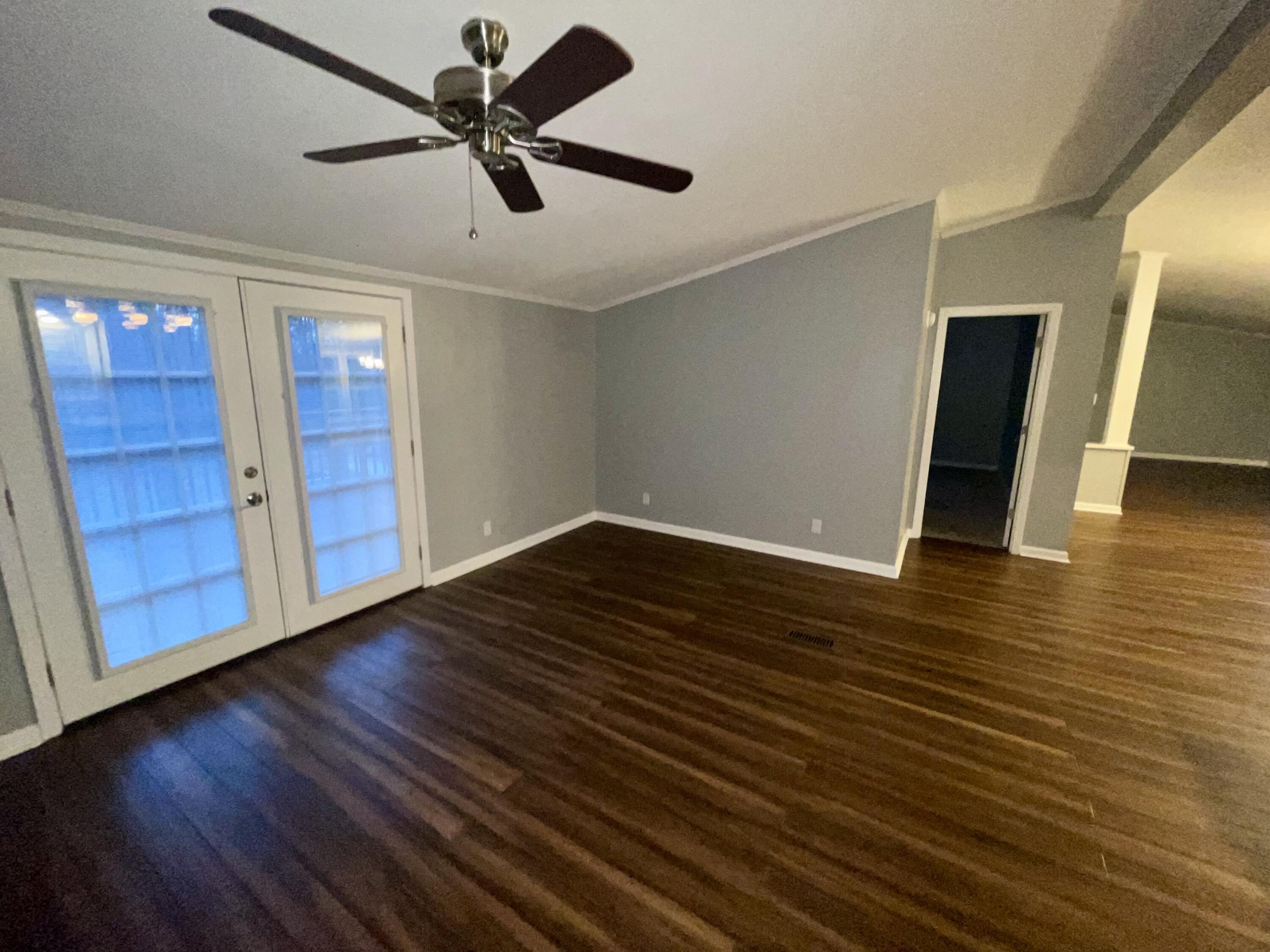 2143 Deep Woods Road Hardy, VA 24101 - Photo 9 of 27 a view of an empty room with wooden floor and a ceiling fan