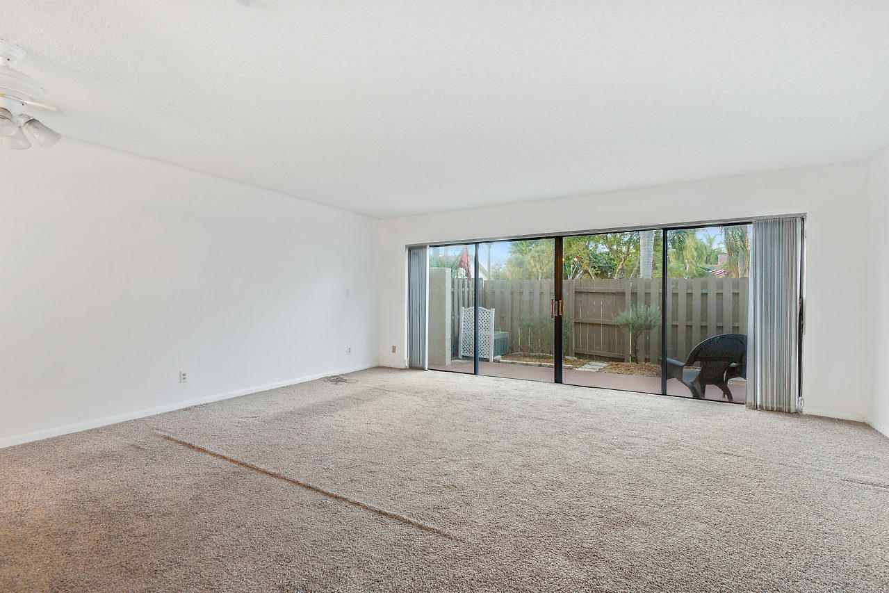 8815 Southwest 21st Street, Unit D Boca Raton, FL 33433 - Photo 12 of 27 a view of an empty room with a large window