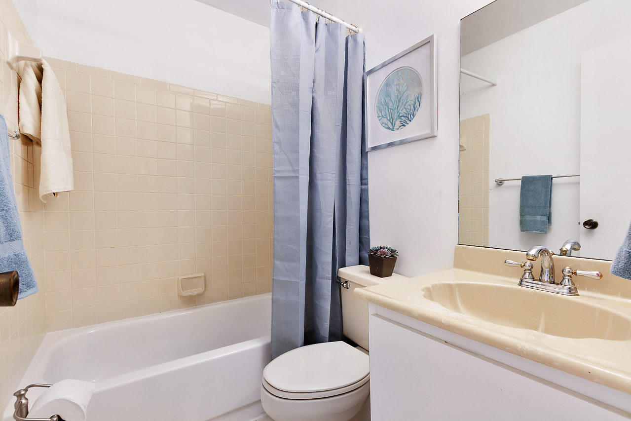 8815 Southwest 21st Street, Unit D Boca Raton, FL 33433 - Photo 15 of 27 a bathroom with a sink a toilet and a bathtub