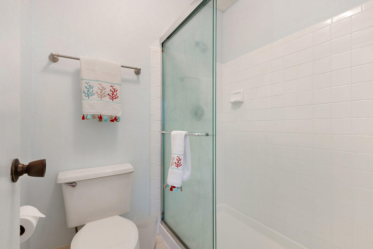 8815 Southwest 21st Street, Unit D Boca Raton, FL 33433 - Photo 19 of 27 a bathroom with a toilet and a shower