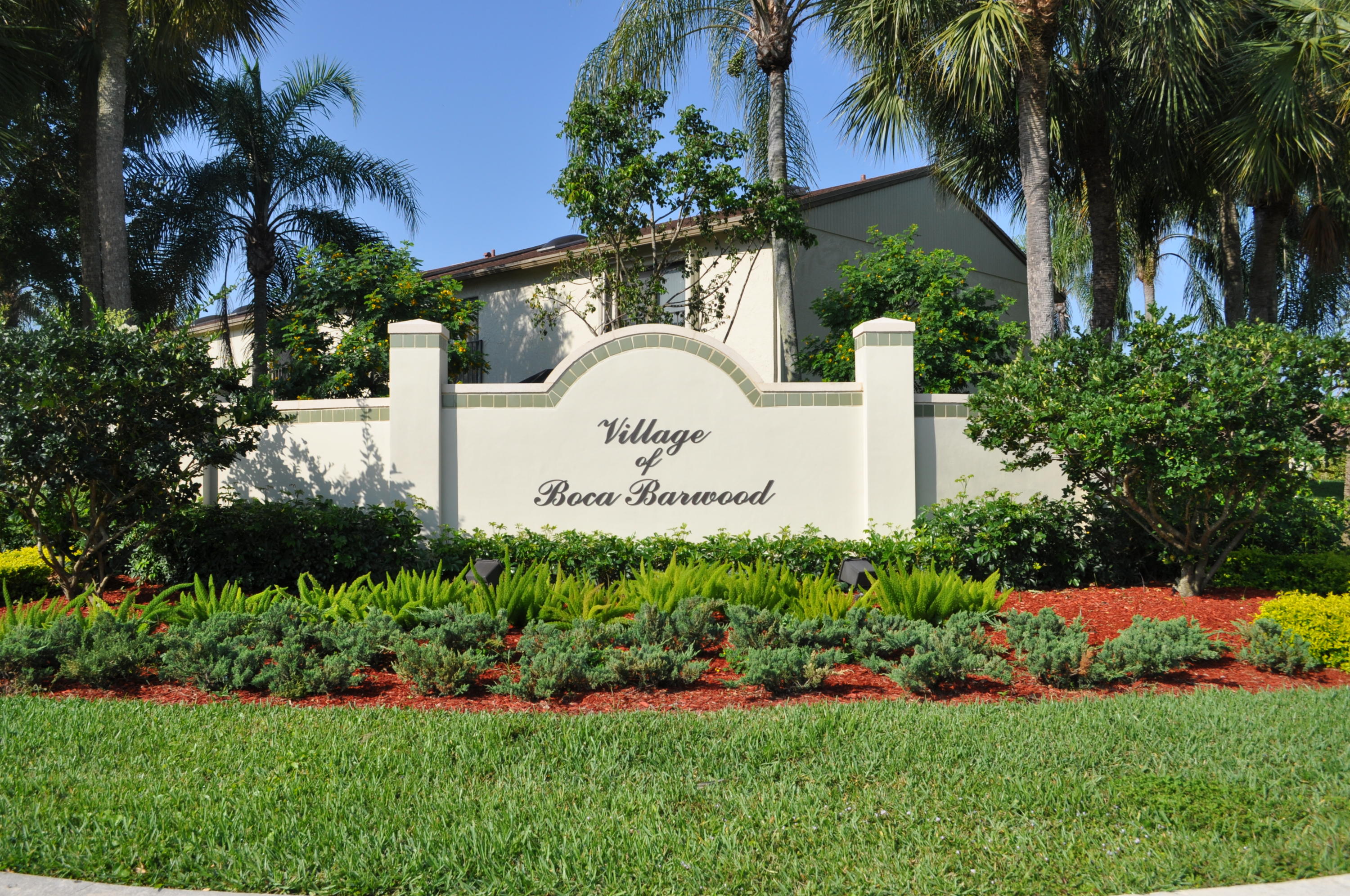 8815 Southwest 21st Street, Unit D Boca Raton, FL 33433 - Photo 25 of 27 a view of a house with a yard and garden