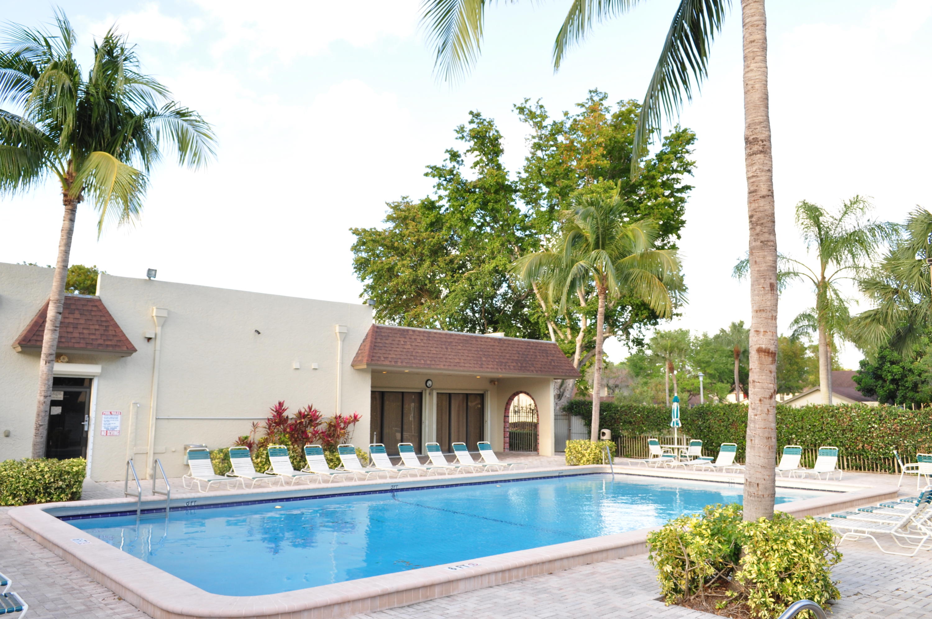 8815 Southwest 21st Street, Unit D Boca Raton, FL 33433 - Photo 26 of 27 a view of a house with pool and sitting area